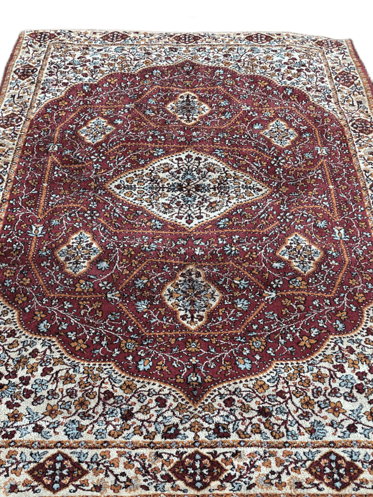 Dark medallion rug that smells weird
