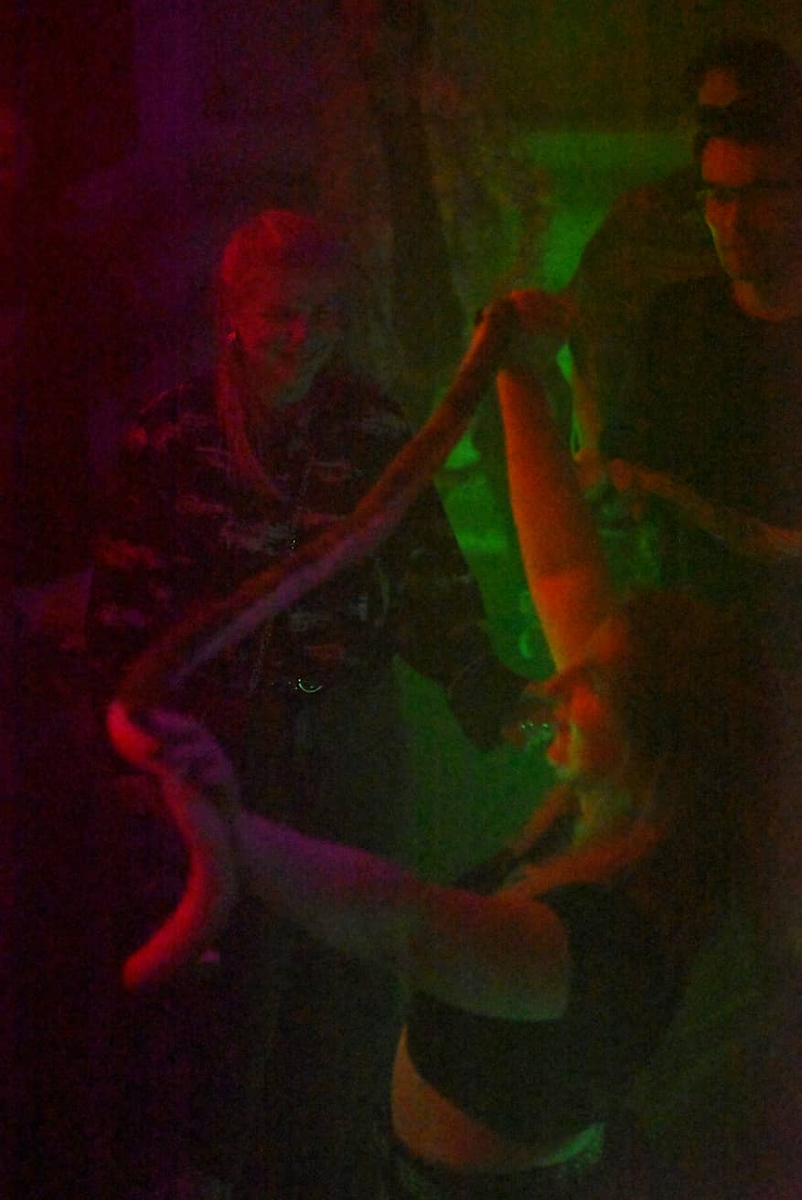 Snek Person holding a snake at the Oasis