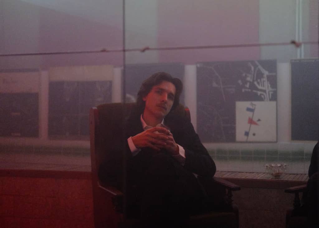 Comfy Business Business person sitting in a comfy chair in front of a mirror