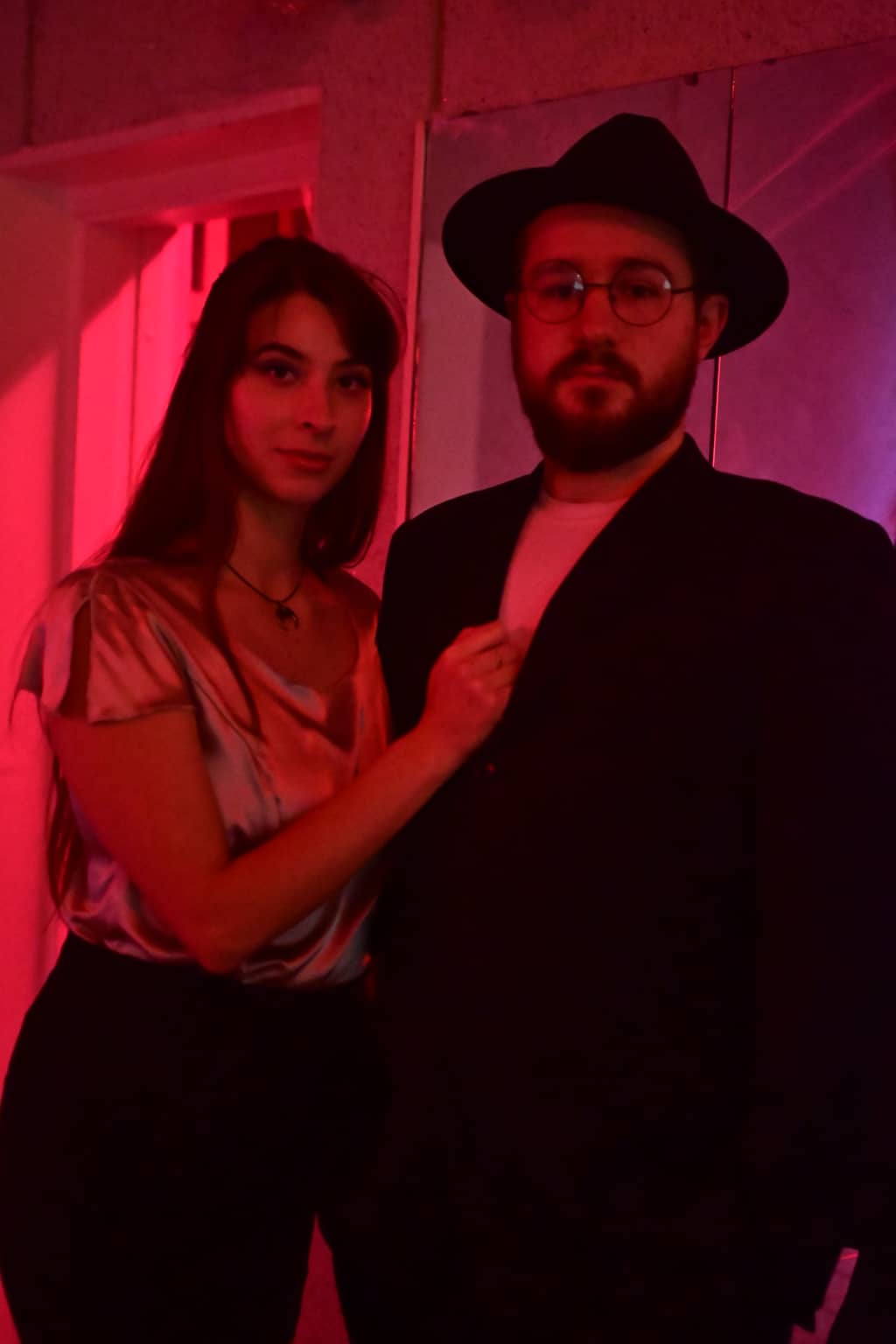 Pool Business (part 1) Two pool party goers standing in front of mirrors