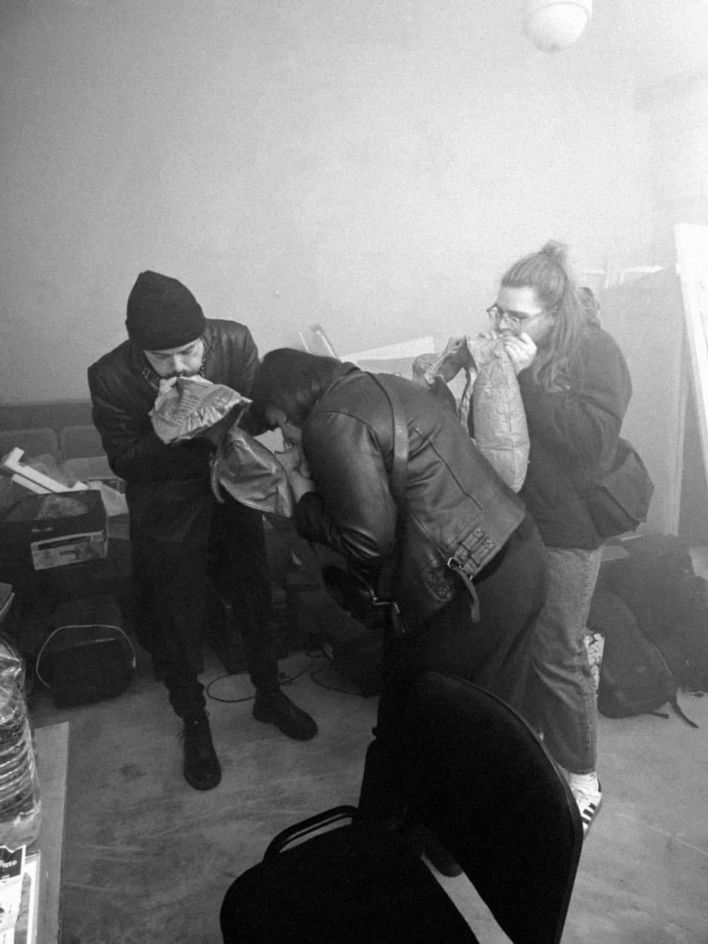 Operation Pool Three people handling a pool inflatable