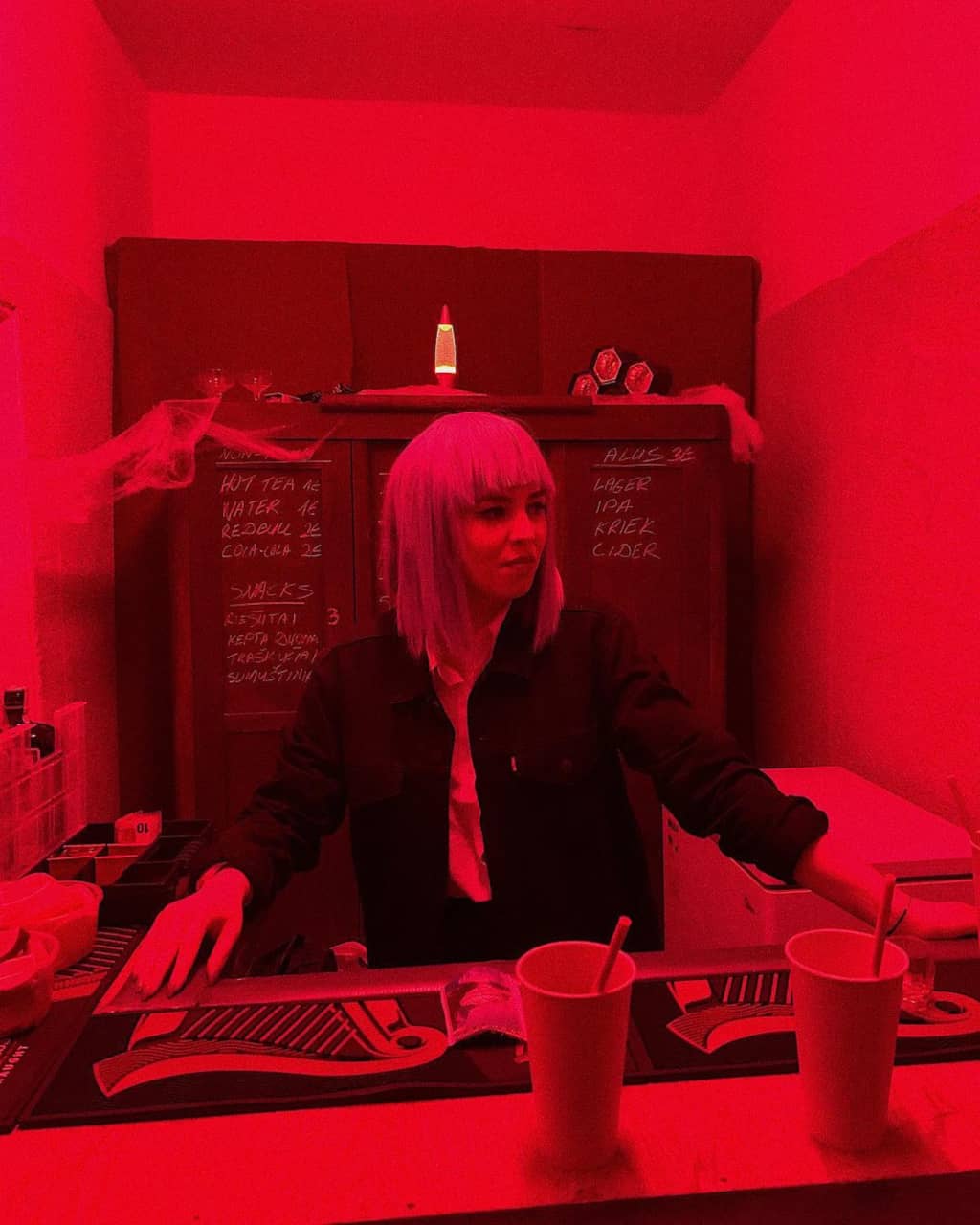 Bartender Person standing behind the bar table top