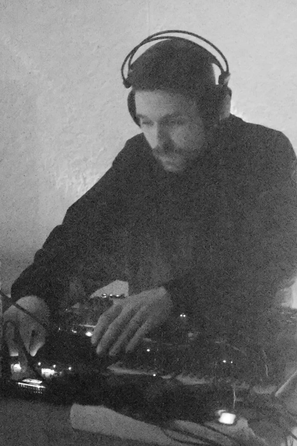 Dovydas playing synths A performer playing synths in black and white colors