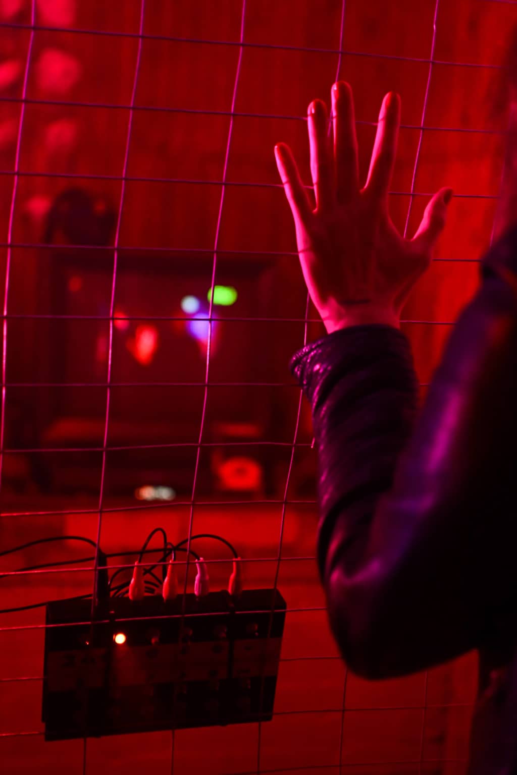 Glitch box VHS glitch box behind bars with a TV, red color