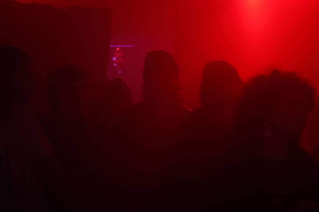 Heated Dance Floor Dance floor, red lights, lots of people dancing in smoke