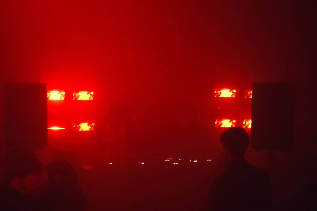 Performers Dance floor, two speakers visible on left and right, two DJs in the middle with DJ gear