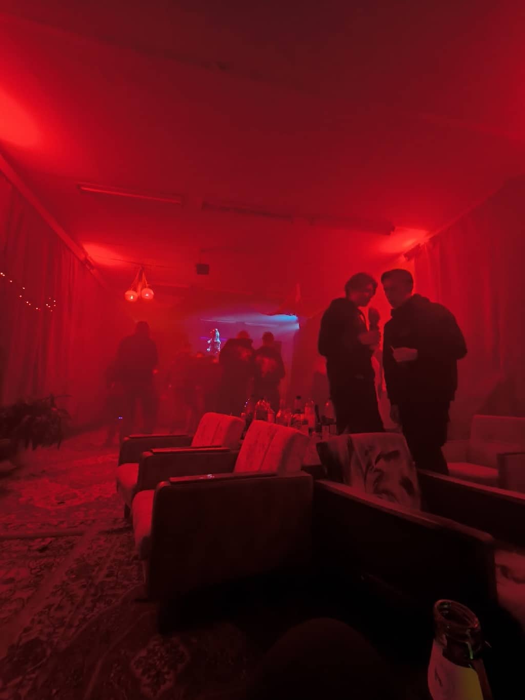 Dance floor with carpets and fancy chairs, now in RED