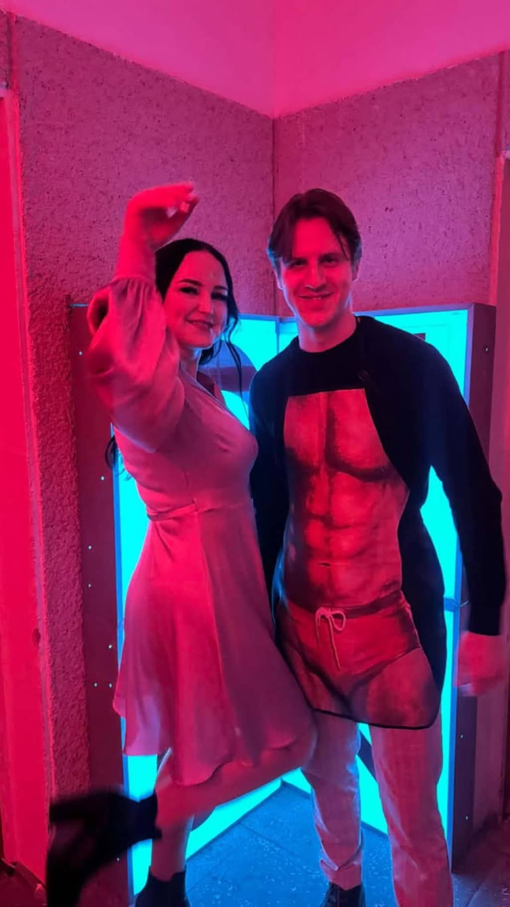 Two people hanging out in front of the SONY sign